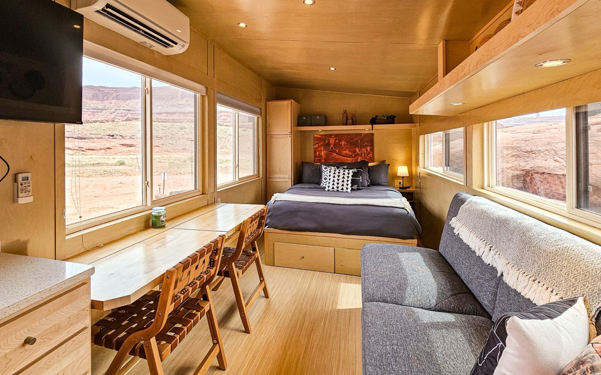 Inside the Redrock cabin, timber lining and windows to the rock