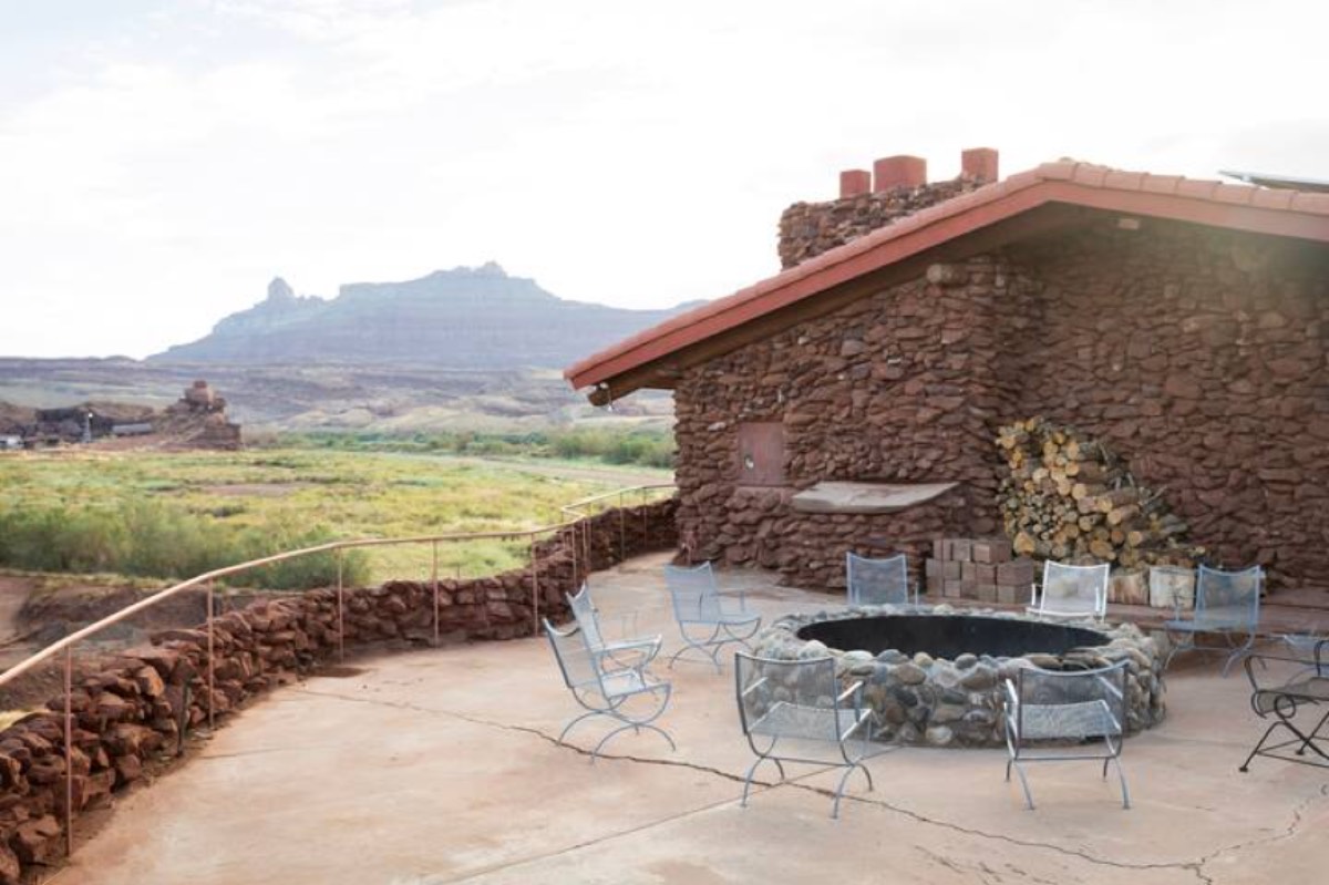 The Ranch House patio and fire ring, with the mesa beyond